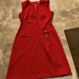 A red summer dress by Calvin Klein.  It’s a size 6.